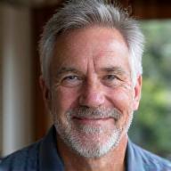 Michael R., a confident man in his early 50s, looking relaxed and happy.