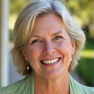 Sarah M., a smiling woman in her late 40s, looking energetic and confident.